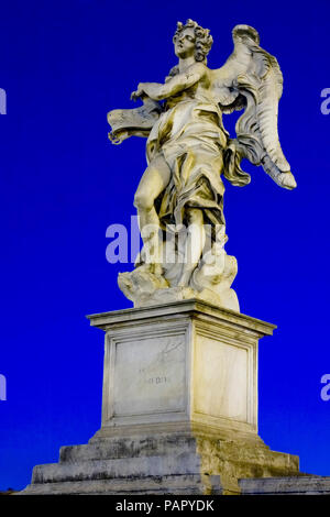 One of Bernini`s statue of angels (Angel with the superscription) on Ponte Sant`Angelo, in front of Castel Sant`Angelo in Rome Stock Photo